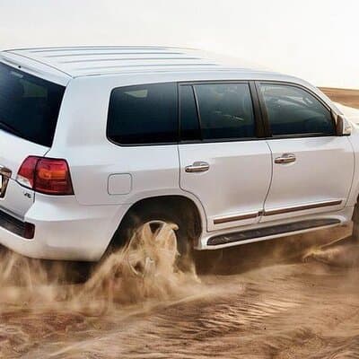 Desert Safari with Camel Ride Sandboarding BBQ and Live Shows