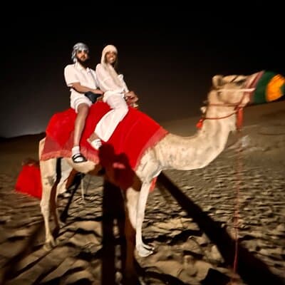 Desert Safari with Camel Ride Sandboarding BBQ and Live Shows 4